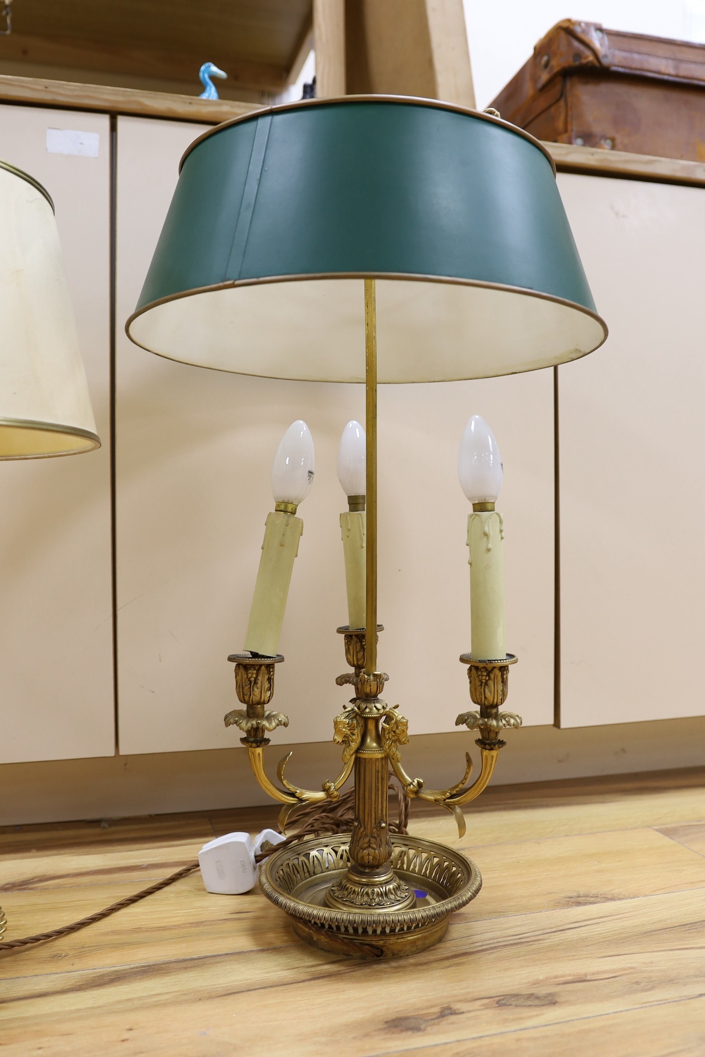 Two large French bouillotte style ornate gilt metal table lamps, tallest 70cm